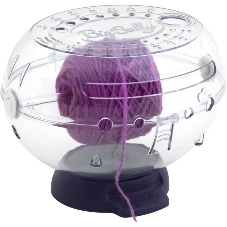 This large, multi-functional, clear globe provides an innovative and protective home for yarn and accessories. Features 6 yarn channels to feed smoothly from either side or front with even tension and no tangling, removeable ball tray to keep multiple balls of yarn separated for colorwork or to accommodate large yarn skeins, and freely rotating yarn spindle allows suspended cones or cakes to rotate smoothly. Hinged lid locks to keep yarn secure and clean, away from dirt and curious pets. This 9x6.5x7.75 inc